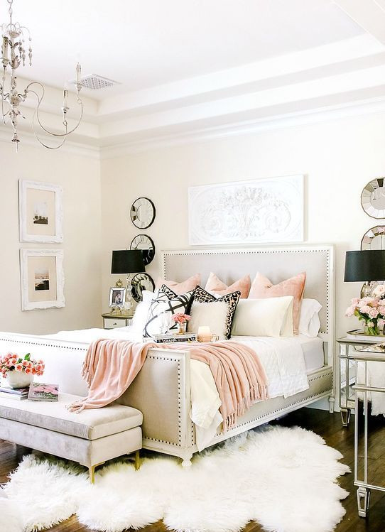 Fake Chandelier for Bedroom Upholstered Wooden Bed Pink Pillows Pink Blanket Cream